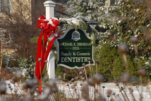 Dental office outside sign with red ribbon for holidays 